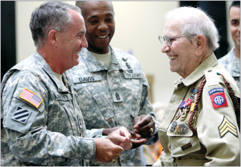 World War II veteran Bob Bearden presented with medals, badges